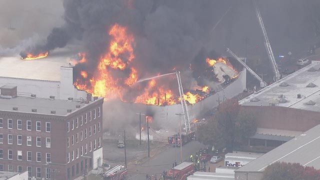 Collapse reported as crews battle 5-alarm warehouse fire; 2 firefighters injured