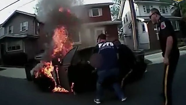 Video shows New Jersey police rescuing man from burning vehicle