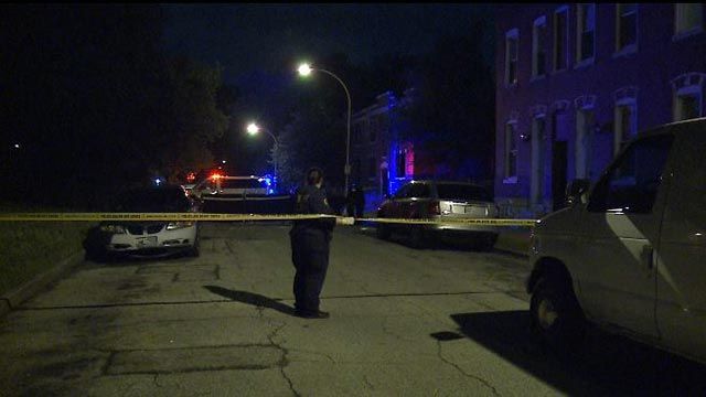 Investigators near the intersection of 25th and Dodier after a man was found dead (Credit: KMOV)