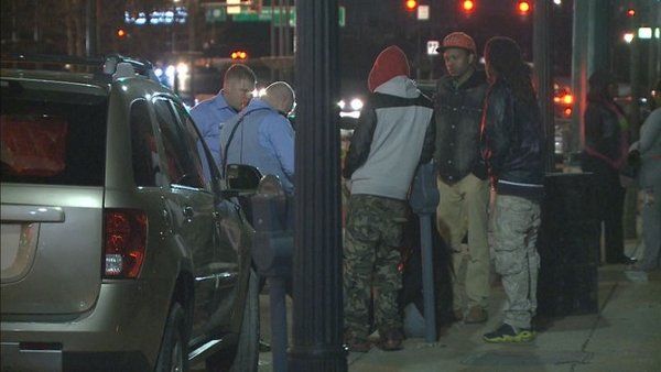 Authorities speak with witnesses after a one-year-old child was shot on March 17