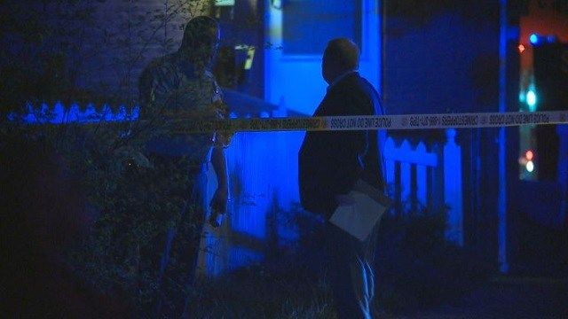 Police investigate the scene of a shooting in St. Louis on Wednesday.