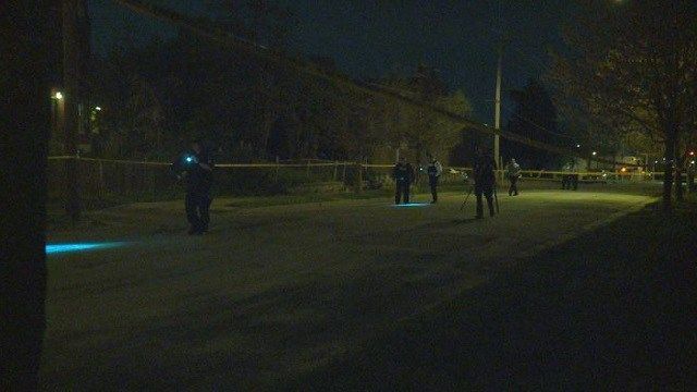 Police investigate the scene of a shooting in St. Louis on Wednesday.
