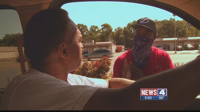 Kenny Boyd speaks to a Ferguson protester on West Florissant on Wednesday